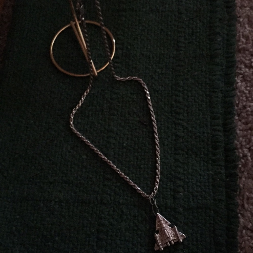 Silver chain with “take flight” pendant